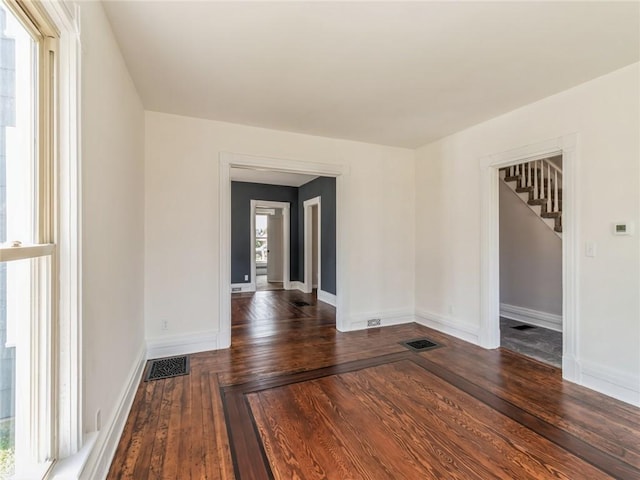 unfurnished room featuring dark hardwood / wood-style floors