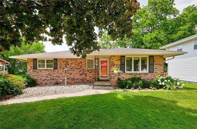 single story home featuring a porch and a front yard