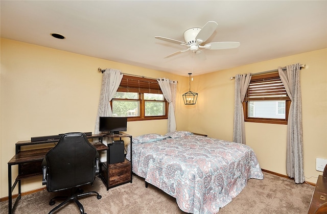 bedroom with light colored carpet and ceiling fan