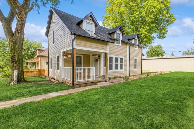 view of front of home featuring a front lawn and covered porch