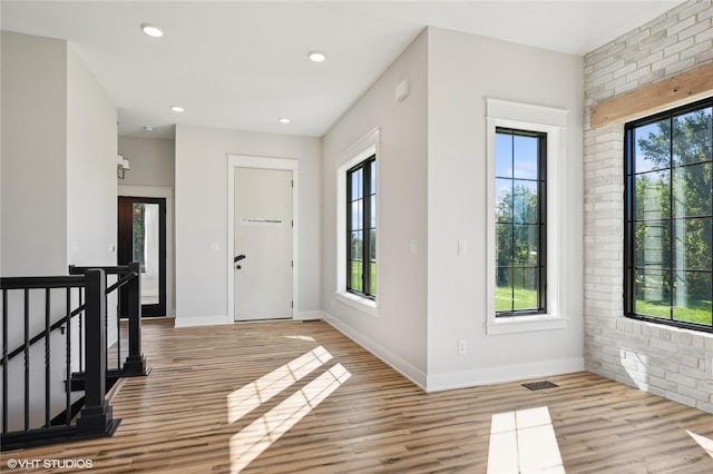 foyer with wood-type flooring