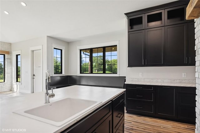 kitchen with sink and light hardwood / wood-style flooring