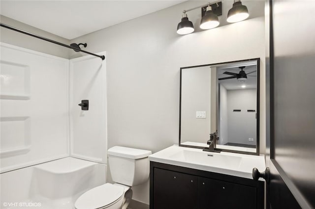 bathroom featuring large vanity, ceiling fan, and toilet