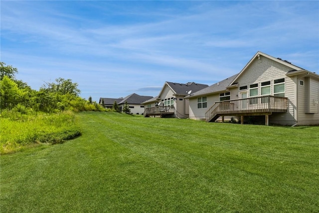 view of yard with a wooden deck