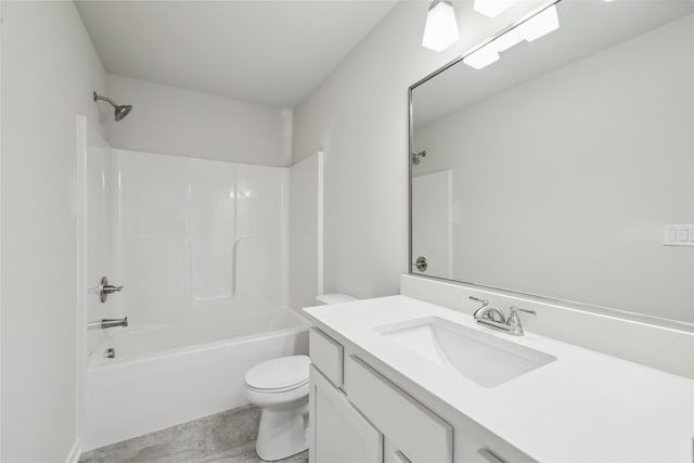 full bathroom with washtub / shower combination, vanity, and toilet