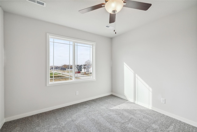 empty room with carpet and ceiling fan