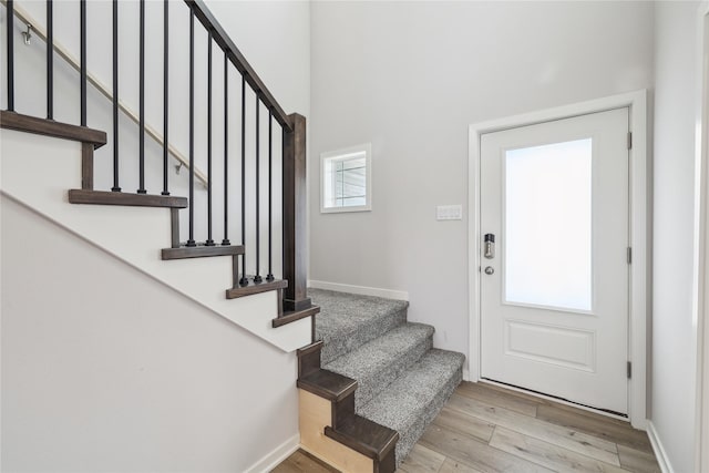 entryway with light hardwood / wood-style floors