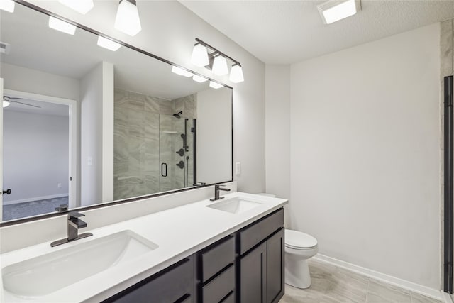 bathroom featuring a textured ceiling, walk in shower, toilet, vanity, and tile patterned flooring