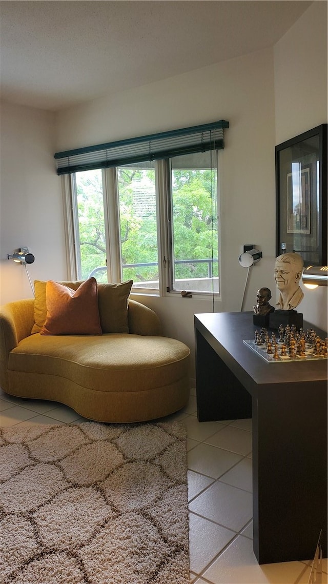 living room with tile patterned flooring