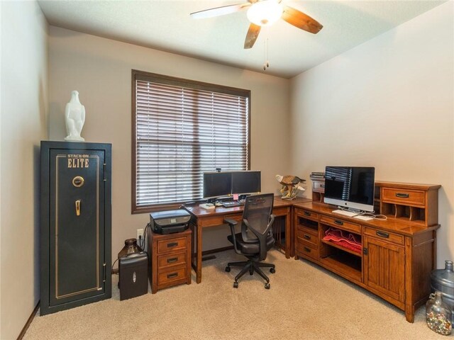 office with light carpet and ceiling fan