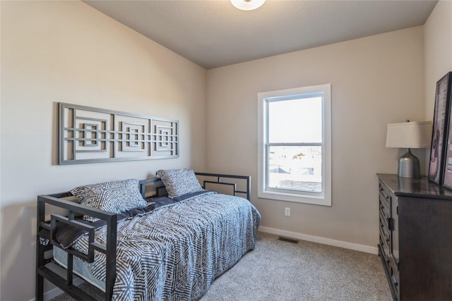 bedroom featuring light colored carpet