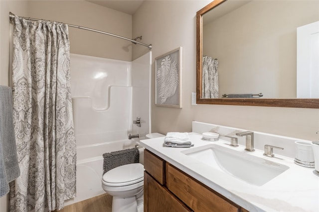 full bathroom featuring hardwood / wood-style flooring, vanity, shower / bath combination with curtain, and toilet