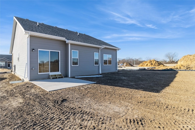 back of house with a patio area