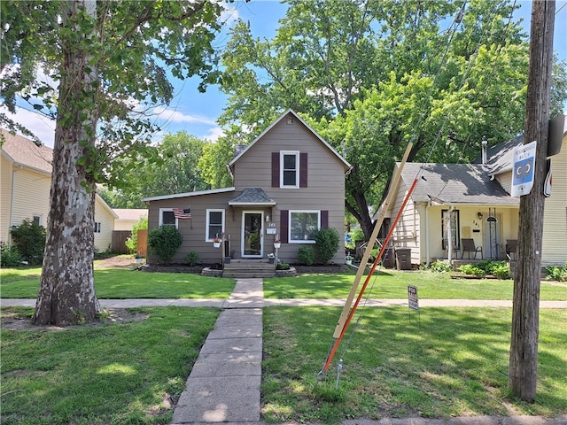 view of front of property with a front lawn