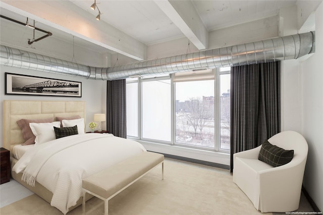 bedroom featuring beamed ceiling