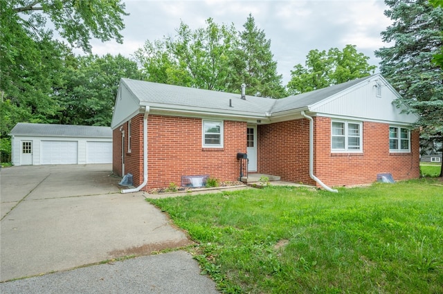 view of front of property featuring a garage, an outdoor structure, and a front lawn