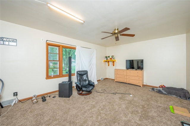 misc room with carpet and ceiling fan