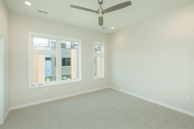 empty room with carpet flooring and ceiling fan