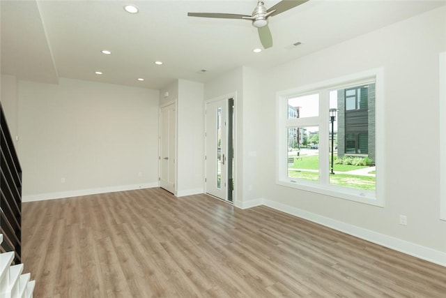 interior space featuring light wood-type flooring and ceiling fan