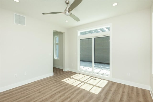 unfurnished room featuring hardwood / wood-style flooring and ceiling fan