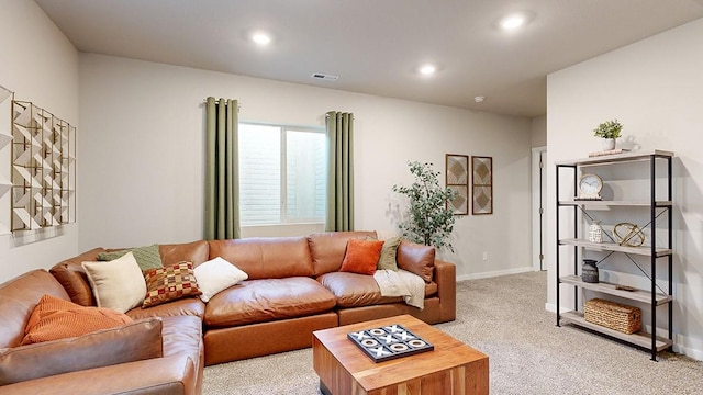 living area with baseboards, recessed lighting, visible vents, and light carpet