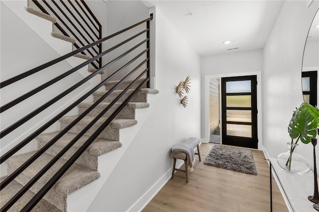 foyer with light hardwood / wood-style flooring