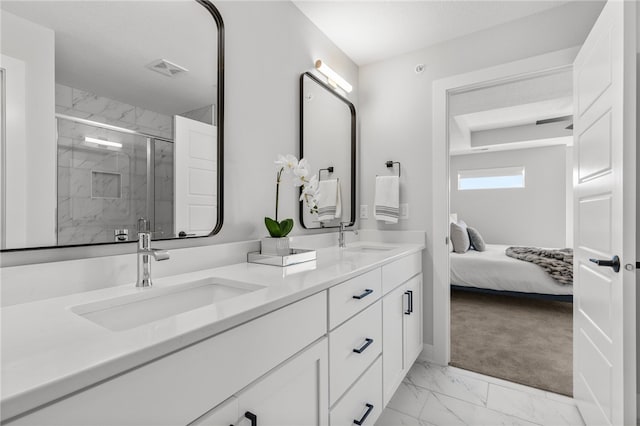 bathroom with vanity and a shower with shower door