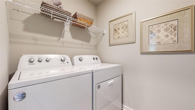 washroom with washer and dryer