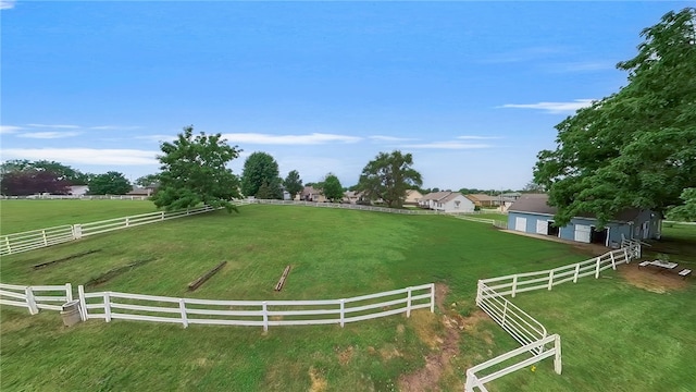 view of yard featuring a rural view and fence