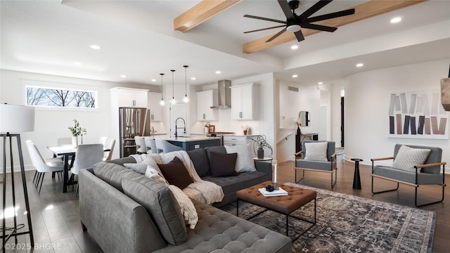 living room with visible vents, a ceiling fan, wood finished floors, beamed ceiling, and recessed lighting