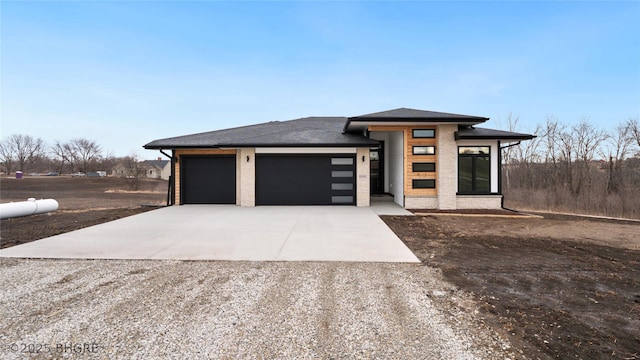 view of front of house with an attached garage and concrete driveway