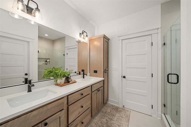 bathroom with vanity, tile patterned floors, and a shower with door