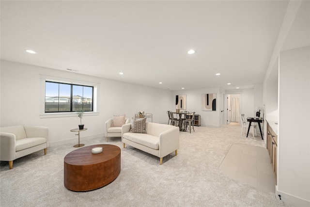 living room featuring light carpet