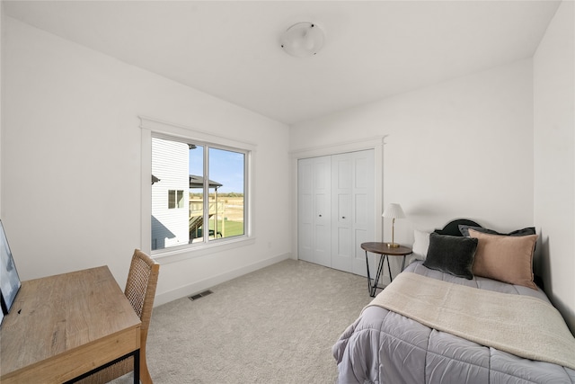 carpeted bedroom featuring a closet