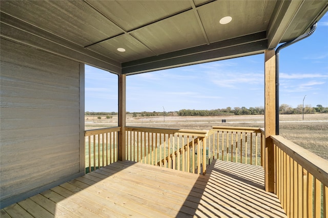 wooden deck with a rural view