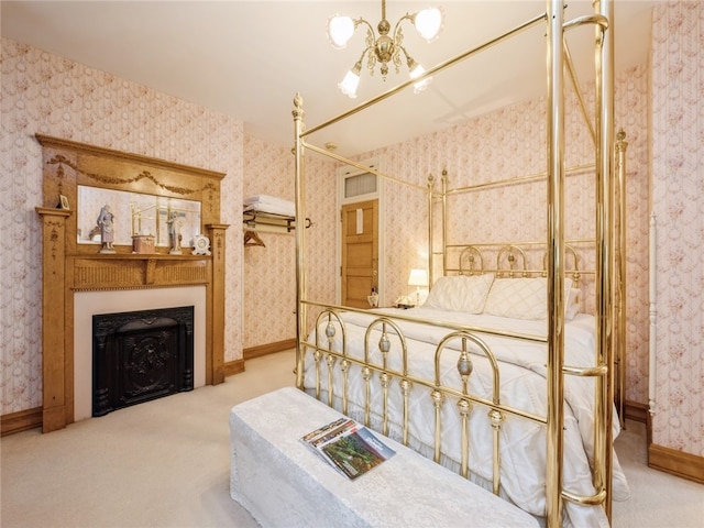 carpeted bedroom with a chandelier