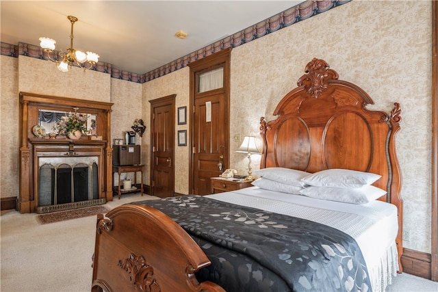 carpeted bedroom featuring an inviting chandelier