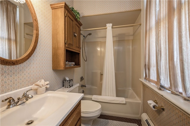 full bathroom featuring shower / bath combo with shower curtain, tile patterned floors, toilet, vanity, and a baseboard heating unit