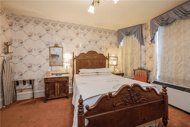 bedroom featuring radiator and carpet flooring