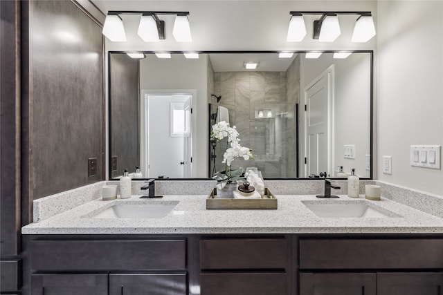 bathroom with vanity and a shower with door