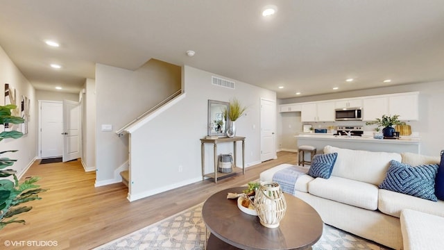 living room with light hardwood / wood-style floors