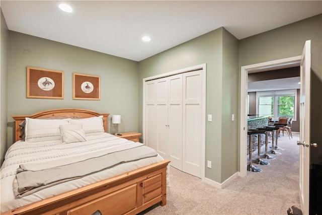 carpeted bedroom featuring a closet