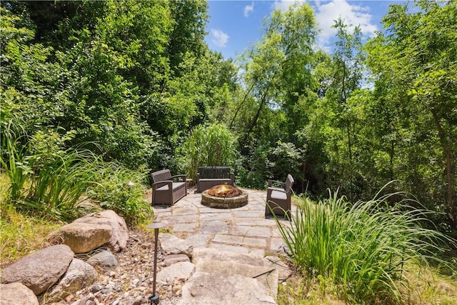 view of patio / terrace with an outdoor fire pit