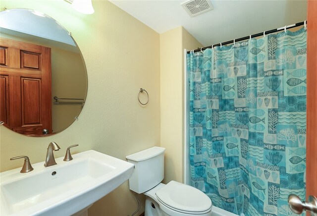 bathroom with sink and toilet