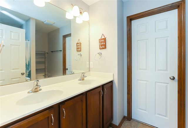 bathroom with double vanity and tile patterned flooring