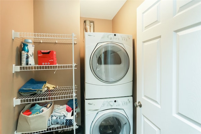 laundry area with stacked washer and dryer