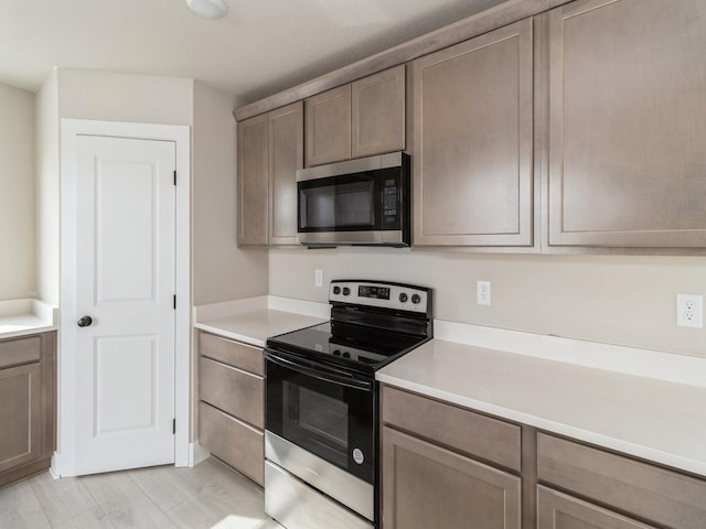 kitchen featuring light countertops and appliances with stainless steel finishes