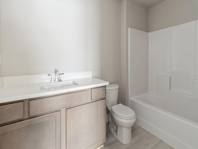 full bathroom with toilet, bathing tub / shower combination, wood finished floors, and vanity