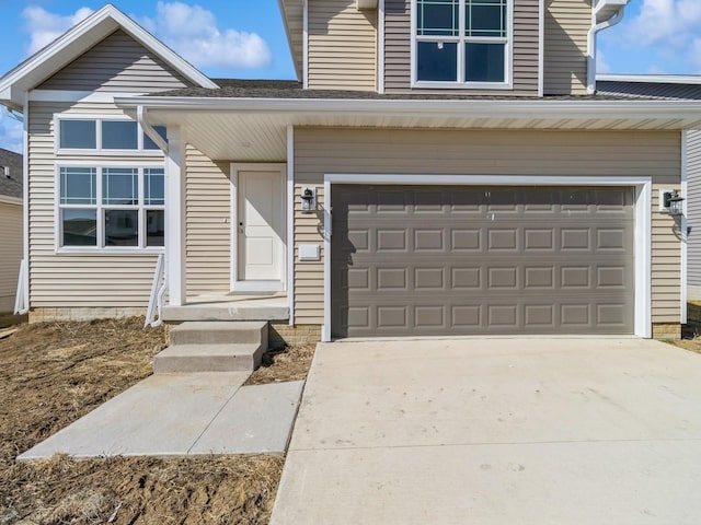 traditional home with an attached garage and driveway