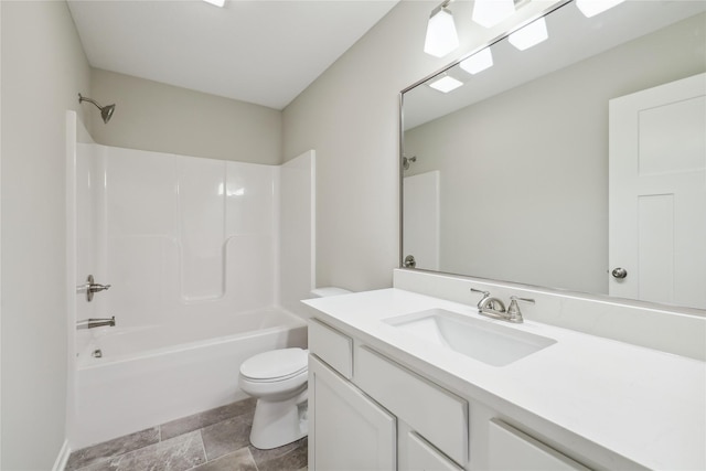 885 NW Frescott Cir, Waukee, IA 50263 - bathroom featuring toilet, shower / washtub combination, vanity, and stone finish flooring